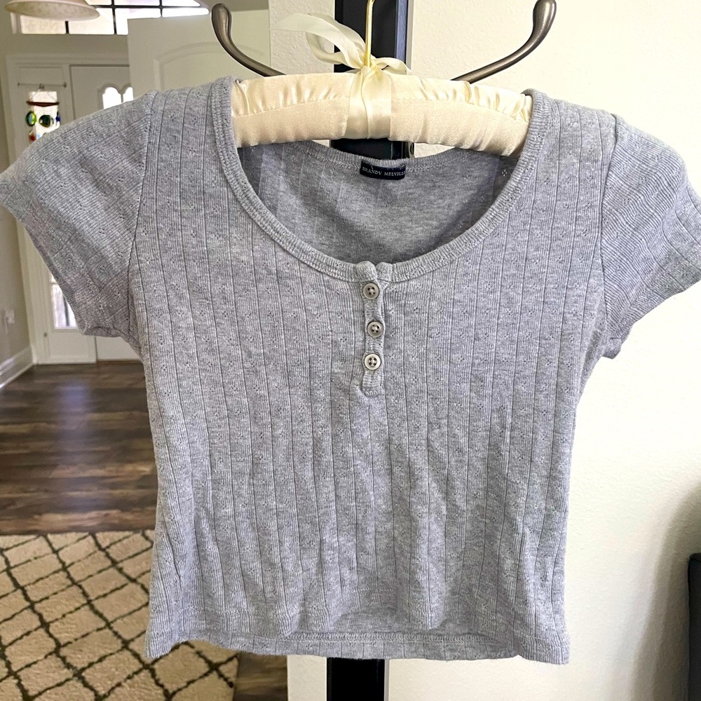 Brandy Melville, gray crop top, three button short sleeve. Size a
